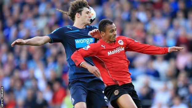 Newcastle defender Fabricio Coloccini (left) battles with Peter Odemwingie of Cardiff