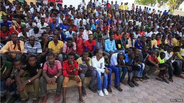 Spectators watch the first soccer match of the Somalia Premier League between Heegan and Gaaddidka at the Banadir stadium in Mogadishu (8 November 2013)