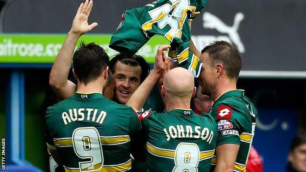 Joey Barton holds up Alejandro Faurlin's shirt as he celebrates his equaliser against Reading