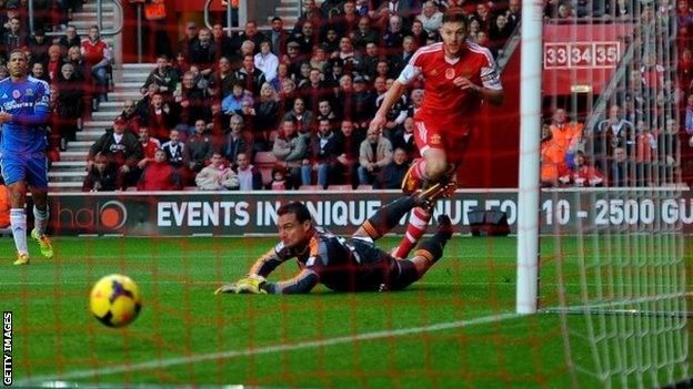 Adam Lallana of Southampton beats Steve Harper of Hull City