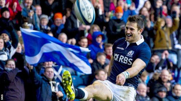 Tommy Seymour celebrates his first try