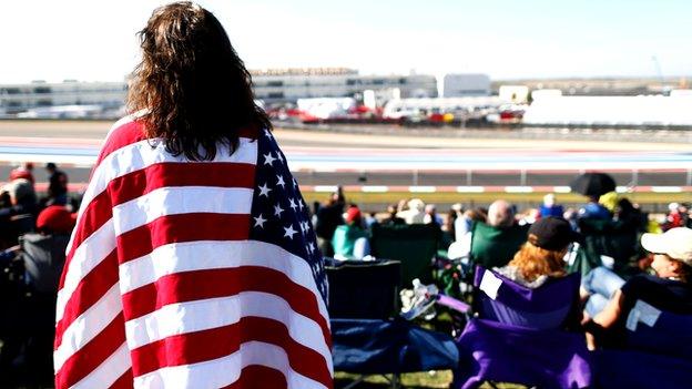 A fan watches the US Grand Prix