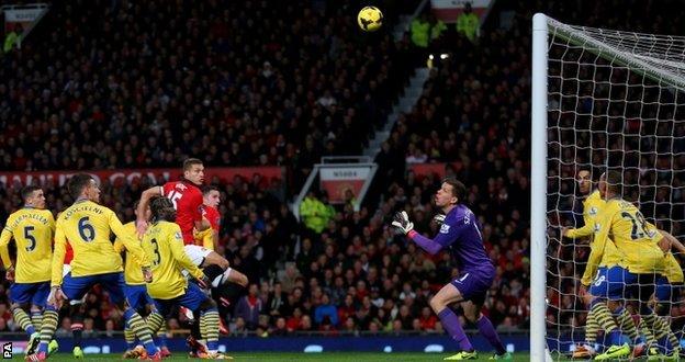 Robin van Persie scores Manchester United's winning goal against Arsenal