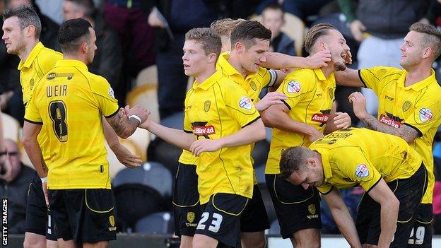 Burton Albion celebrate against Hereford United