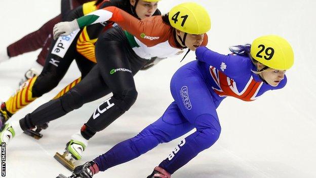 Elise Christie (right) in action the quarter-finals of Britain's short-track skating Olympic qualifier