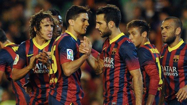 Barcelona players celebrate scoring against Real Betis