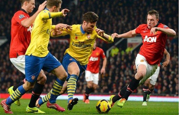 Phil Jones (r) worked tirelessly to keep Arsenal quiet