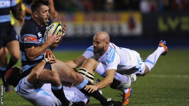 Blues centre Dafydd Hewitt is tackled by Worcester Warriors duo Leonardo Senatore (left) and Paul Hodgson during Friday night's LV = Cup clash at Cardiff Arms Park