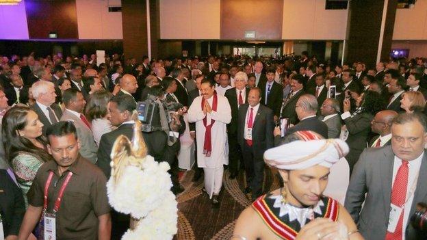 In this handout photo provided by Sri Lankan Government, Sri Lankan President Mahinda Rajapaksa (C) attends the inaugural session of The Commonwealth Business Forum on November 12, 2013 in Colombo, Sri Lanka.