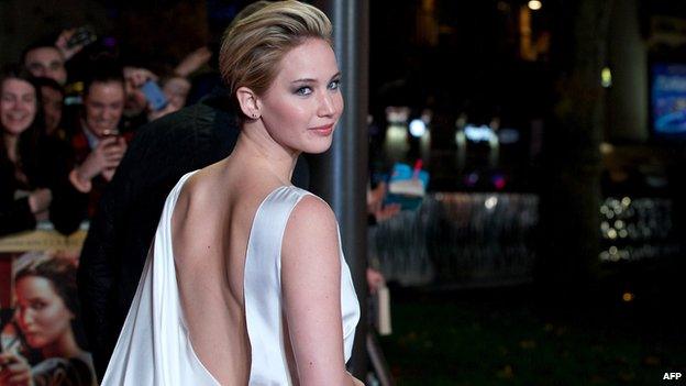 US actress Jennifer Lawrence poses for pictures on the red carpet upon arrival for the world premiere of the film.