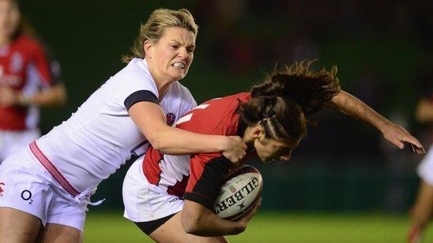 England's Michaela Staniford tackles Bianca Farella of Canada