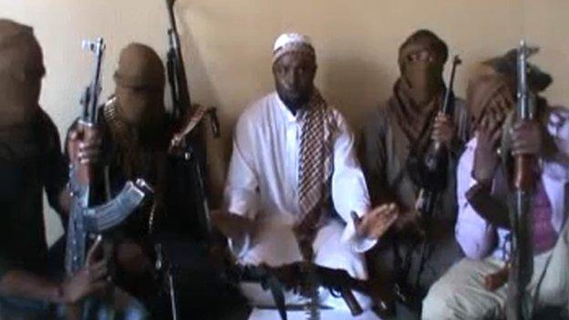A screen grab allegedly showing Boko Haram leader Abubakar Shekau (C) flanked by militants