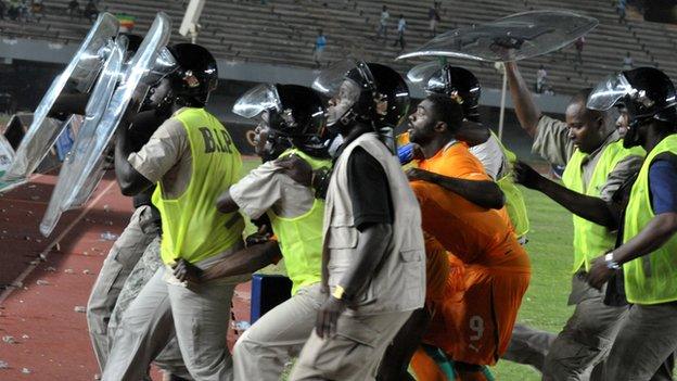 Ivorians take refuge during the riot that affected last year's Nations Cup qualifier in Senegal.