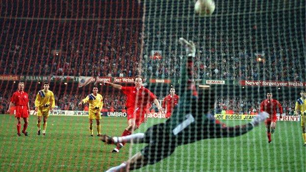 Paul Bodin strikes his penalty against the bar