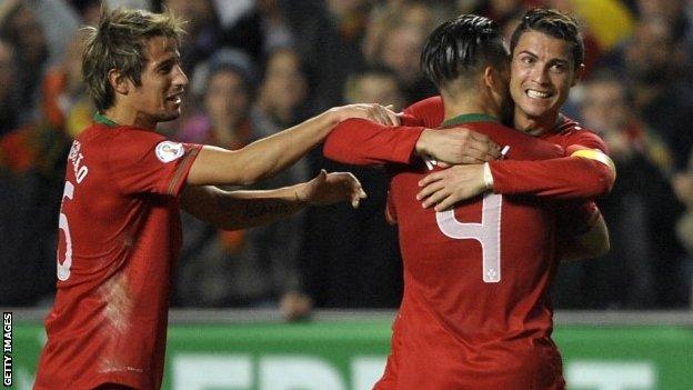 Portugal forward Cristiano Ronaldo (right) celebrates with team-mates after scoring a goal during the World Cup qualifier play-off first leg football match vSweden