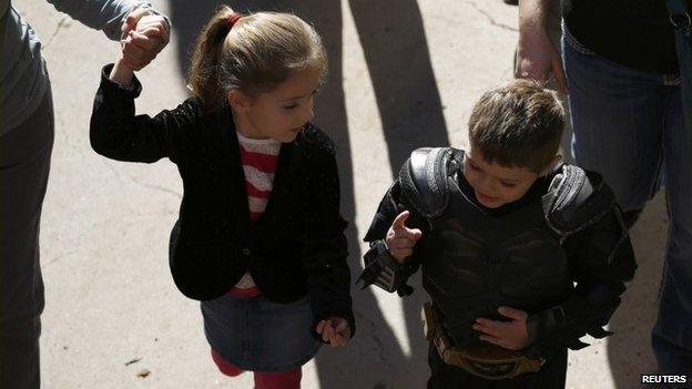 Batkid speak to a fan at AT&T Park on 15 November 2013