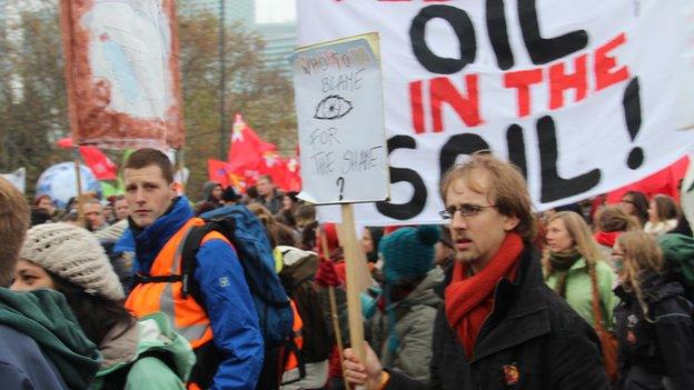 Protesters marching in Warsaw demanded rapid action on climate change