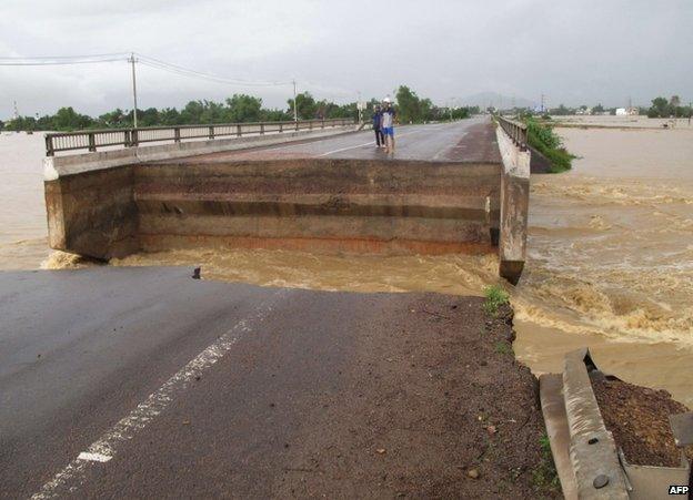 A bridge shattered by flooding in Binh Dinh province, Vietnam, 16 November