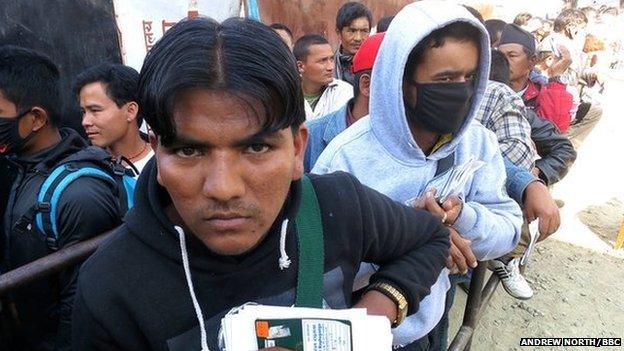 Young men outside the department for foreign employment in Kathmandu