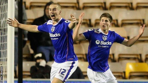 Danny Philliskirk celebrates scoring against Wolves