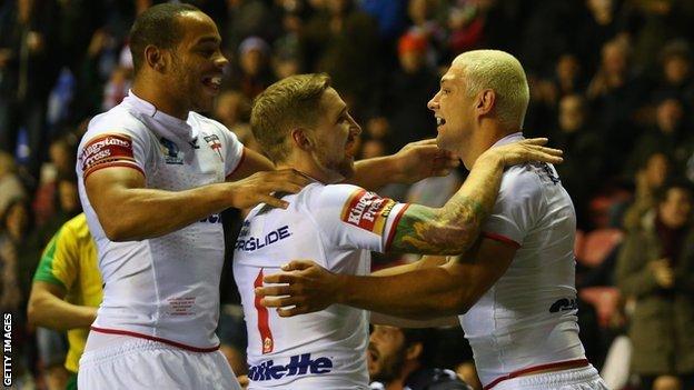 England celebrate a try during the win over France