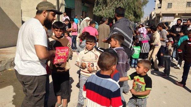 Maqsood hands out sweets in Syria