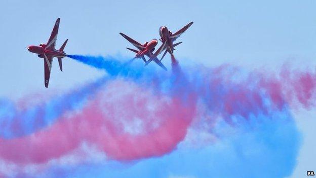 The RAF Red Arrows perform ahead of the Royal International Air Tattoo