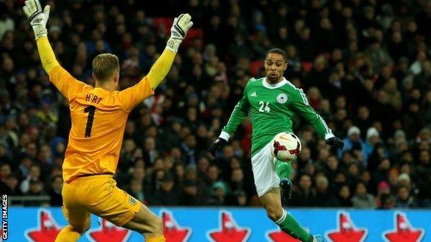 England goalkeeper Joe Hart and Germany's Sidney Sam