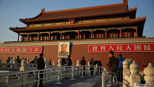 The plainclothes policemen guard in front of Tiananmen Gate outside the Great Hall of the People where the Communist Party's 205-member Central Committee gathered for its third annual plenum on 12 November 2013 in Beijing, China