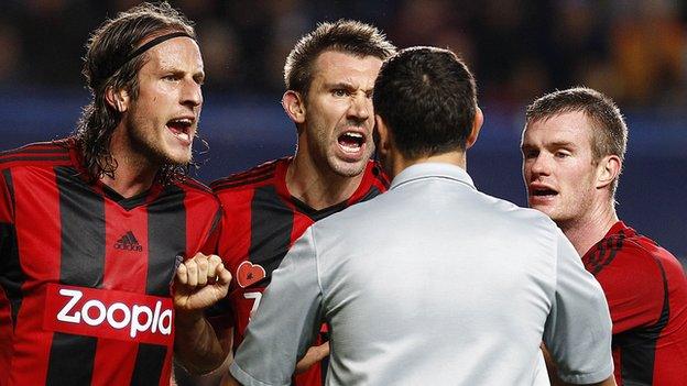 Angry Albion players Jonas Olsson, Gareth McAuley and Chris Brunt appeal to referee Andre Marriner over his decision to award Chelsea a penalty at Stamford Bridge