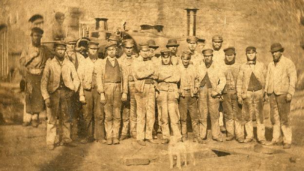 Neath Abbey Ironworks and workers, possibly taken around 1870. The engine in the background is works locomotive Plymouth