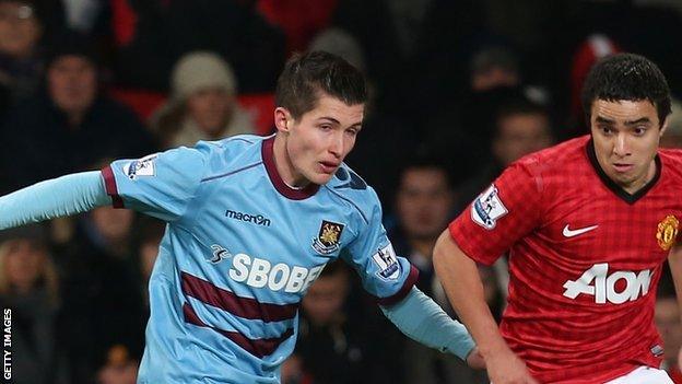 Dan Potts in action against Rafael Da Silva of Manchester United