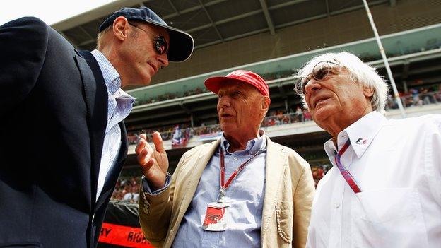 Donald Mackenzie (left) talks to former F1 World Champion Niki Lauda (centre) and F1 supremo Bernie Ecclestone