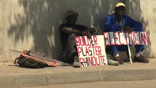 Job hunters with placards