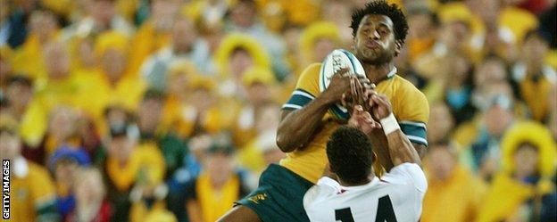 Lote Tuqiri jumps above Jason Robinson to score Australia's try