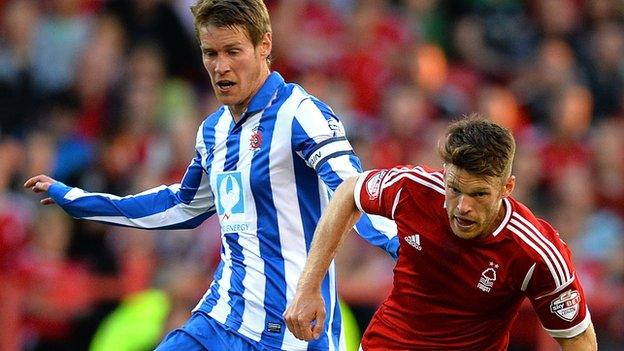 Hartlepool captain Tony Sweeney (left) battles with Nottm Forest's Jamie Mackie