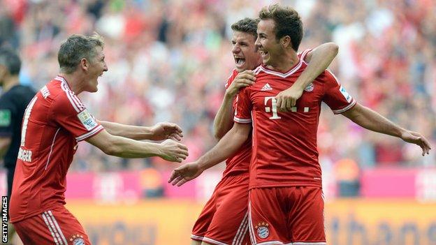 Bastian Schweinsteiger, Thomas Muller and Mario Gotze celebrating for Bayern Munich