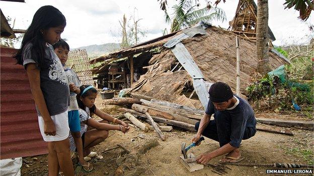 Vic Bataluna from Barotac Viejo, Iloilo is straightening out old nails to use them again. Vic says they have received some relief but he wishes for some materials like nails to help people rebuilding their houses..