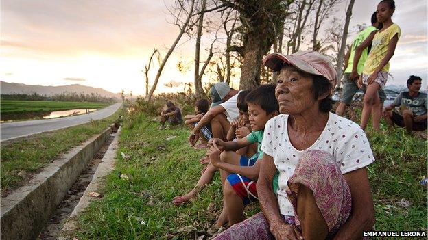 Nelly Paclibar (foreground) from Ilawod, Lemery, Iloilo, is waiting with other kids for another day to end at one of the roadsides. The typhoon left a lot of houses without power. Authorities estimate it might take two to three months before electricity is completely restored in some affected towns.