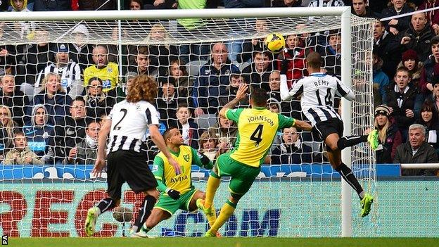 Newcastle striker Loic Remy (right) heads his side in front against Norwich