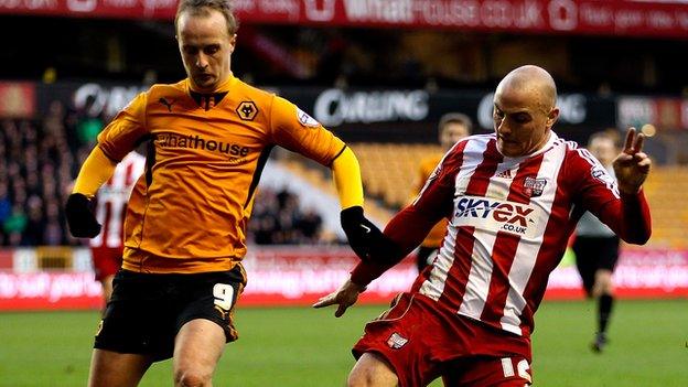 Wolves top scorer Leigh Griffiths contests a loose ball at Molineux with Brentford midfielder Alan McCormack