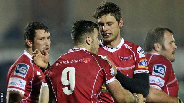 Gareth Davies is congratulated after scoring the third Scarlets try in Galway