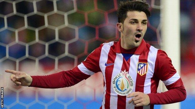 Atletico Madrid forward David Villa celebrates scoring against Getafe