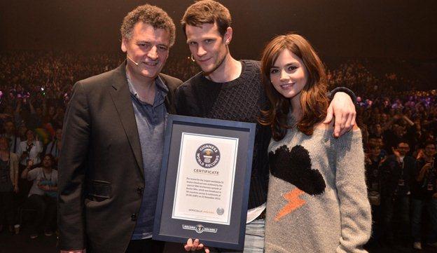 Steven Moffat, Matt Smith and Jenna Coleman accept the programme's World Record certificate