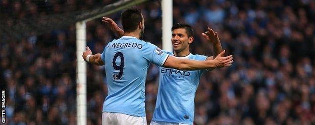 Alvaro Negredo and Sergio Aguero celebrate after Negredo scores City's fifth goal against Spurs