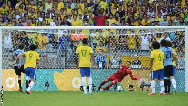 Julio Cesar saves Diego Forlan's penalty