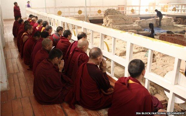 Monks within the Maya Devi Temple at Lumbini in Nepal