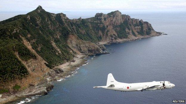 Japanese PC3 surveillance plane flies around the disputed islands in the East China Sea on 13 October 2011