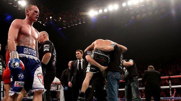 George Groves (left) looks on dejectedly as Carl Froch celebrates