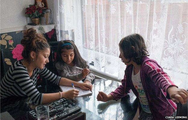 Katerina, 15, and Andrea, 9, spend time with a cousin